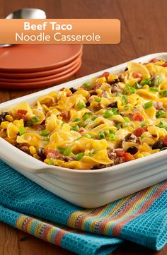 a casserole dish with beef taco noodle bake in it on a table