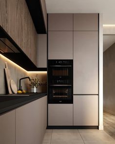 a modern kitchen with an oven and microwave