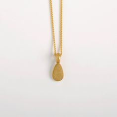 "This Egg Shaped Pendant is made of 22k Solid Gold and it is a part from our 'Middle Line' collection. Metal: 22k yellow solid gold Gold pendant length: approx. 10 mm (0.4\") | width: 6.5 mm (2.5''). Inner diameter of the link: approx. 3 mm. We can make it larger at your request. We chose to use 22 karat gold for our weight pendants, for their high density. It's a small, concentrated pendant, a small object with a satisfying weight to it, keeping it centered on its chain. Whether around the neck Minimal Pendant, Necklace Woman, Minimal Gold, Graduation Jewelry, Wedding Pendant, Minimal Necklace, Solid Gold Necklace, Gold Necklace Women, Teardrop Necklace