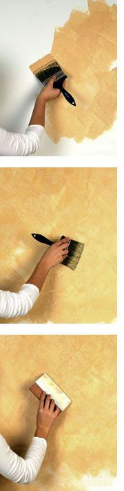 a woman is painting the wall with yellow paint