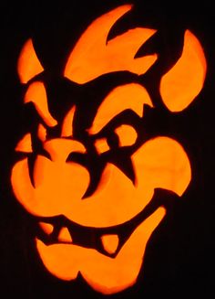 a carved pumpkin with an angry face on it