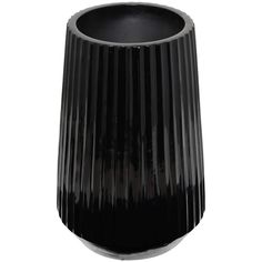 a black vase sitting on top of a white table