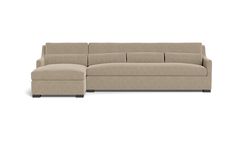 a large sectional couch with an ottoman and footstool in beige fabric, viewed from the front