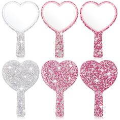 three heart shaped mirrors with pink and silver sequins