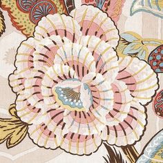 an image of a flower with many colors and patterns on the fabric, as well as flowers