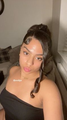 Bun Swoop Hairstyle, Bun With Side Curl, Easy Hairstyles With Edges, Curly Bun With Side Bang, Hairstyles 2 Buns, Bun With Curls Hanging Down, Hairstyles That Cover Ears, Middle Part Low Bun, Low Buns Hairstyle