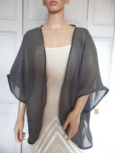 This is a beautiful hand made chiffon kimono ideal as a cover-up for weddings or special occasions. It has a satin edging. It can be made in any size from 8 to 24 (UK sizes). It is made in the UK. It is normally sent out to you within 5 days, but I am very happy to make your order a priority if you need it urgently. Just let me know the date needed by. Postage is free in the UK! International postage is £9. I am happy to exchange items or refund your payment if you are less than happy with the p Elegant Long Flowy Cover-up, Elegant Flowy Kimono For Beach Cover-up, Elegant Flowy Wrap Kimono, Elegant Wrap Kimono For Beach Cover-up, Elegant Wrap Kimono For Beach, Elegant Evening Cover-up For Spring, Chiffon Kimono Jacket, Cute Maxi Skirts, Crochet Bolero Pattern