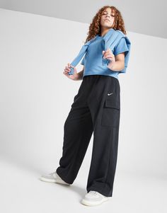 Keep your street style laidback with these junior girls' Wide Leg Cargo Joggers from Nike. In a Black colourway, these off-duty pants are made from a brushed cotton-poly fleece, with Dri-FIT tech added in to wick sweat away. They have a drawcord tie on the elasticated waistband to cinch in the top hem, while the wide legs offer room at the ankles. Finished off with spacious cargo pockets and the signature Swoosh. Machine washable. Nike Cargo Pants, Nikes Girl, Cargo Joggers, Nike Tech, Nike Blazer, Junior Outfits, Black Nike, Jd Sports, Wide Legs