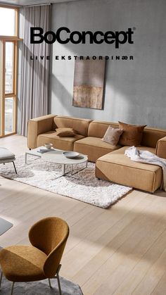 a living room filled with furniture on top of a hard wood floor