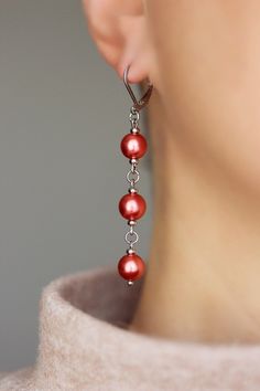 Unique pearl earrings with bright red-pink high quality czech glass pearl coated 8 mm beads, tiny stainless steel beads-separators, steel jumping ringa and stainless steel lever back earring hooks. Earring hooks are from nickel free and lead free metal. The total lenght of earrings is about 65 mm including earring hooks. Perfect jewelry for everyday wear and a great gift! Other earrings of my shop you can see here: https://www.etsy.com/shop/NaTavelli?section_id=13757927 Thanks for visit! Red Round Pearl Drop Earrings, Red Pearl Drop Round Earrings, Red Dangle Pearl Earrings For Party, Red Drop Pearl Earrings For Gift, Red Dangle Pearl Earrings For Jewelry Making, Handmade Red Pearl Earrings, Handmade Red Round Pearl Earrings, Red Pearl Drop Earrings, Elegant Red Dangle Pearl Earrings