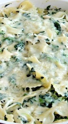 a casserole dish with broccoli, cheese and spinach in it