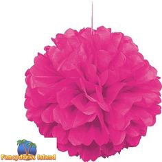 pink tissue pom - poms hanging from the ceiling