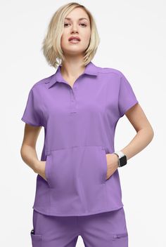 It’s a bit of a departure, but we love this scrub top. The polo collar and 3-snap placket give it a polished look, while the oversized fit and dolman sleeves make it so comfortable. The Easy Stretch Collection is designed with a modern look and fit. Luxurious stretch fabric keeps you comfortable all shift long, never needs ironing. • Oversized fit • Polo collar • Front snap placket • Total of 3 pockets • 2 roomy onseam front pockets • 1 mesh pocket inside right pocket • Short dolman sleeves • ID Med Couture Scrubs, Yoga Scrub Pants, Carhartt Scrubs, Healing Hands Scrubs, Leg Scrub, Koi Scrubs, Scrub Style, Top Polo, Greys Anatomy Scrubs