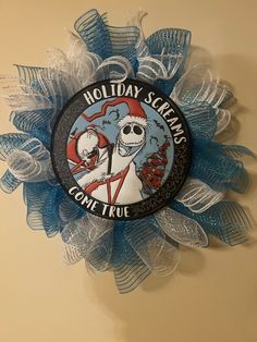 a blue and white wreath with a skeleton on it