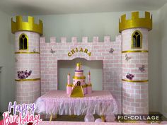 a pink princess castle bed with a table and chairs