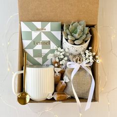 a gift box containing coffee, tea and succulents for someone's special occasion