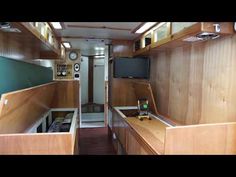 the inside of an rv with wood paneling