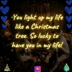 two people sitting at a table in front of a christmas tree with the words you light up my life like a christmas tree so lucky to have you in my life