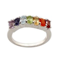 Colorful gems of powerful beauty are designed to align with their respective chakras in a ring from Alok Jain. Crafted of sterling silver the ring is crowned with amethyst iolite citrine peridot garnet quartz and carnelian set within a gentle curve. Their colors correspond to a specific chakra for clear and light purple stones are associated with the 7th chakra (awareness and wisdom); the purple violet and indigo gems with the 6th chakra (insight and perception) and the blue or light blue with t Spiritual Multi-stone Oval Rings, Spiritual Oval Multi-stone Rings, Rainbow Gemstone Accented Ring, Oval Multi-stone Spiritual Rings, Rainbow Gemstone Accented Jewelry Ring, Spiritual Sterling Silver Gemstone Ring, Spiritual Amethyst Ring With Accent Stones, Spiritual Multi-stone Oval Gemstones, Spiritual Silver Birthstone Ring With Accent Stones