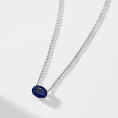 A modern classic, this brilliant oval shaped east-west solitaire faux sapphire necklace brings the perfect touch of sparkle to any neckline. ABOUT THE PRODUCT Metal: Sterling SilverPlating: RhodiumStones: Simulated Sapphire-Colored Gemstone, 8mm x 6mm (approx. diamond equivalent weight 1.25 ct)Chain Length: 16 in + 2 in extender Modern Sapphire Jewelry In Oval Shape, Modern Sapphire Jewelry With Oval Shape, Modern Sapphire Oval Jewelry, Modern Oval Sapphire Jewelry, Classic Oval Clavicle Chain Necklace, Oval Solitaire Necklace In Sterling Silver, Modern Sapphire Necklace For Formal Occasions, Modern Blue Oval Necklace, Silver Oval Solitaire Necklace