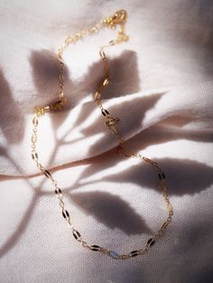 A super sparkly basic chain your gold necklace collection, our delicate gold dapped chain is the perfect everyday necklace. Made from 14kt Gold Filled, this versatile chain is the perfect layering essential.✦ DETAILS ✦✧ Name: Hokupa'a (hoo KOO leh) - star wreath.✧ 14kt Gold Filled.✧ All Ke Aloha Jewelry pieces come packaged thoughtfully, beautifully, and ready for gift giving.✧ Unless otherwise noted in the listing description, all pieces are sold individually. Photos with models/multiple pieces Star Wreath, Gemstone Hoop Earrings, Necklace Collection, Gold Filled Hoops, Everyday Necklace, Leh, Earrings Collection, Delicate Necklace, Gold Hoops