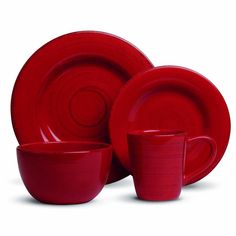 red dinnerware set with matching cups and saucers in the shape of spirals