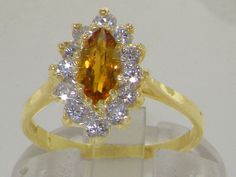 "*This floral ring is made from 375 9K Yellow Gold prong setting with Natural Semi-precious Citrine & Gorgeous Precious Diamonds (Total 0.48ct). *Total Height 7, Width 10mm, Length 14mm A beautiful Citrine & Diamond Ring set with a center large 8x4mm (0.32\" x 0.16\" inches) radiant Marquise Citrine & twelve 2.25mm (0.09\" inches) brilliant, vibrant precious Diamonds in an adorable 9K Yellow Gold Victorian Style setting. These are total near half carat of Genuine Precious Sparkle Dia Gold Cluster Ring With Birthstone, Gold Birthstone Cluster Ring, Gold Marquise Cluster Ring With Accent Stones, Gold Cluster Birthstone Ring With Gemstone, Radiant Marquise, English Vintage, Diamond Ring Set, Floral Ring, Diamond Ring Settings