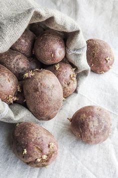 some potatoes are sitting in a bag on the table