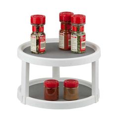 two tiered spice rack holds spices and seasonings