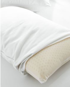 an image of a pillow and pillows on the bed