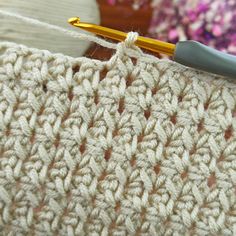 the crochet stitch is being worked on