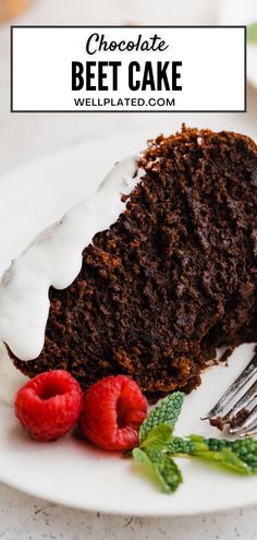 a slice of chocolate beet cake on a plate with raspberries and a fork