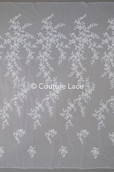 an image of white flowers on grey background with text that reads couture lace