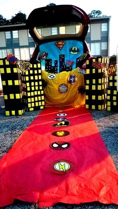 a red table cloth on the ground with buttons and magnets in front of it