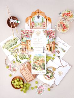 the wedding stationery is laid out with cards, envelopes, and other items