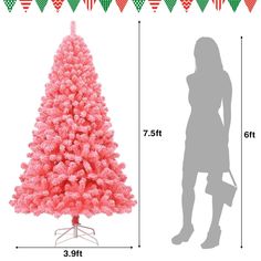 a woman standing next to a pink christmas tree