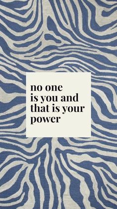 a blue and white zebra print fabric with the words, no one is you and that is your power