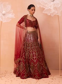 Experience timeless elegance with this dreamy lehenga, featuring intricate floral and geometric embroidered motifs. Paired with a butta work blouse and a scalloped hand-embroidered dupatta, this ensemble seamlessly combines artistic craftsmanship with sophisticated style, ideal for any special occasion. Embroidered Bridal Lehenga, Pre Bridal, Blouse Lehenga, Modern Bridal Gowns, Lehenga Pattern, Lehenga Dupatta, Embroidered Motifs, Red Lehenga, Indian Wedding Wear