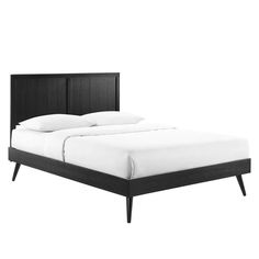 a bed with white sheets and black headboard on top of it, against a white background