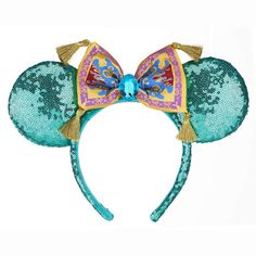 a close up of a mickey mouse ears headband with a blue and yellow bow