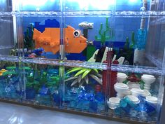 an aquarium filled with lots of different types of toys