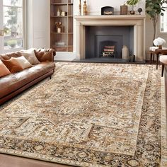 a living room filled with furniture and a large rug on top of a wooden floor