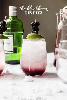 the blackberry gin fizz cocktail is garnished with blackberries