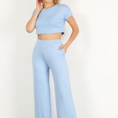 Solid Two Piece Pants Set Featuring A Short Sleeve Crop Top And High Waisted Wide Leg Pants With Pockets. Cotton Bottoms In Matching Set, Casual Fitted Cropped Wide Leg Pants, Casual Stretch Sets With High-waisted Pants, Solid Color Pant Set For Spring Loungewear, Solid Color Spring Loungewear Pant Set, Solid Cropped Pants For Loungewear, Solid Cropped Loungewear Pants, Cotton Wide Leg Pants Matching Set, Solid Cropped Pants For Spring