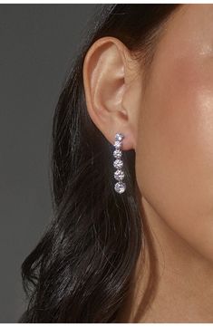 Lines of graduated cubic zirconia swing shine into these drop earrings. 1 1/4" drop; 1/4" width Rhodium plate/cubic zirconia Imported Nadri Jewelry, Summer Wardrobe Essentials, Sneaker Slippers, Modern Shop, Baby Boy Shoes, Hair Fragrance, Made Clothing, Boy Shoes, Toddler Girl Outfits