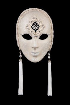 White Penelope White Penelope authentic venetian mask in papier mache with metal decoration. Handcrafted according to the original Venice carnival tradition. Manufactured in Venice by the famous venetian masters.  Each item is provided with certificate of authenticity. H25 x W20 cm Venice Mask, Venetian Carnival Masks, Mask White, Theatre Masks, Venetian Masquerade, Lace Mask, Venetian Masks, White Mask, Venetian Mask