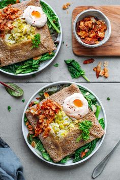 two plates filled with food on top of a table