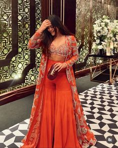 Haldi Trending Outfits, Western Indian Outfits Women, Orange Indian Lehenga, Western Wedding Ideas Dresses, Ethnic Indo Western Outfits, Destination Wedding Indian Outfits, Trending Outfits Traditional, Designer Ethnic Wear For Women, Orange Indo Western Outfits