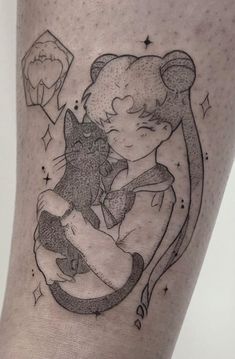 a woman's leg with a cat and diamond tattoo on the side of her thigh