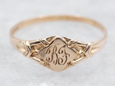 This exquisite ring features a tasteful "BF" engraving, adding a touch of sophistication and exclusivity to your look. Made with yellow gold, this ring is the perfect accessory for those who appreciate the finer things in life! Metal: 10K Yellow Gold Top Measurements: 5.0 mm, Diamond Shaped Monogram: "BF" Engraved Ring Size: 1.50 Marks: "()10K" Stamped on the inside band SKU #: A49943 Each piece has been identified and graded by a Graduate Gemologist who has been certified by the Gemological Institute of America (GIA). We have six brick-and-mortar storefronts in Maine, Massachusetts, and New Hampshire and have been in business for over 25 years! Please visit our Shop's About Page or our website for more information about our jewelry. For questions about diamond grading, we recommend the  G Formal Oval Engraved Ring With Etched Details, Heirloom Style Engraved Ring With Hallmarks For Wedding, Heirloom Engraved Ring With Hallmarks For Wedding, Heirloom Engraved Wedding Ring With Hallmarks, Victorian Rings With Engraving Option For Anniversary, 14k Gold Engraved Ring With Maker's Mark As Gift, Elegant Etched Engraved Ring For Promise, Victorian Etched Rings For Anniversary, Formal Heirloom Ring With Maker's Mark